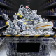 Reebox's special Ghostbusters: Afterlife shoes sit atop a grocery cart piled high with Stay-Puft marshmallows and marshmallow men.